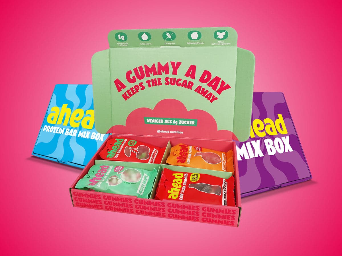 ahead Nutrition gummy and protein bar selection boxes on a pink background.
